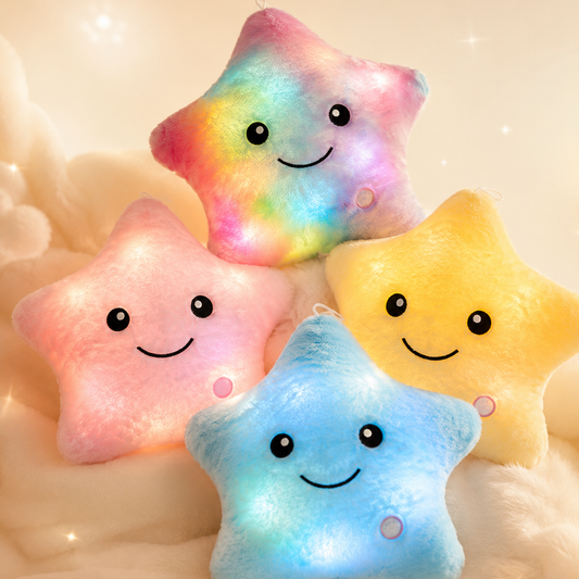Glowshie light-up star pillows displayed in rainbow, pink, yellow, and blue colours.